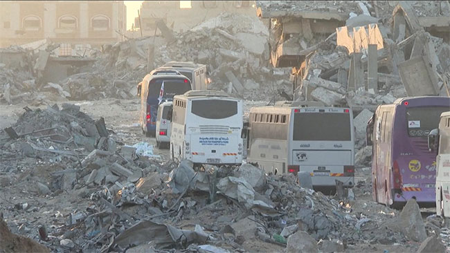 38 buses carrying Palestinian prisoners arrive in Gaza - with all living hostages back in Israel