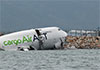Cargo plane slides off runway in Hong Kong, media reports two dead
