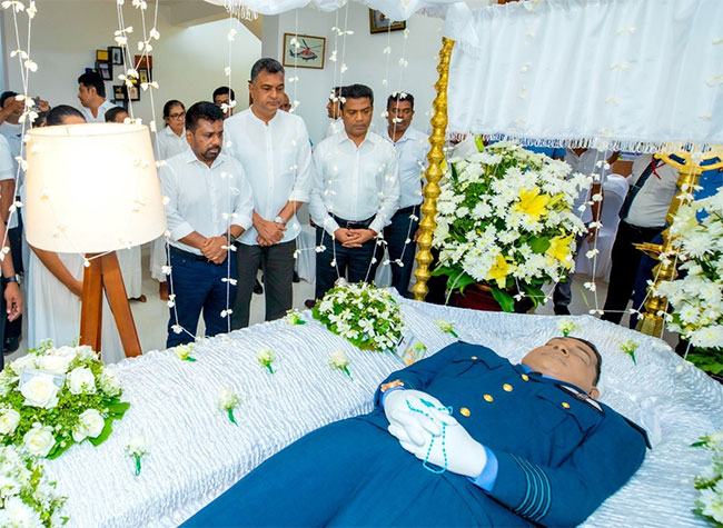 President pays final respects to helicopter pilot killed in flood rescue mission 