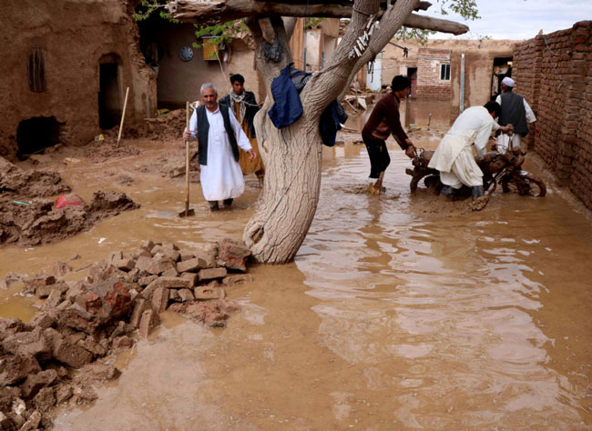 Flash floods triggered by heavy rains in Afghanistan kill at least 17 people