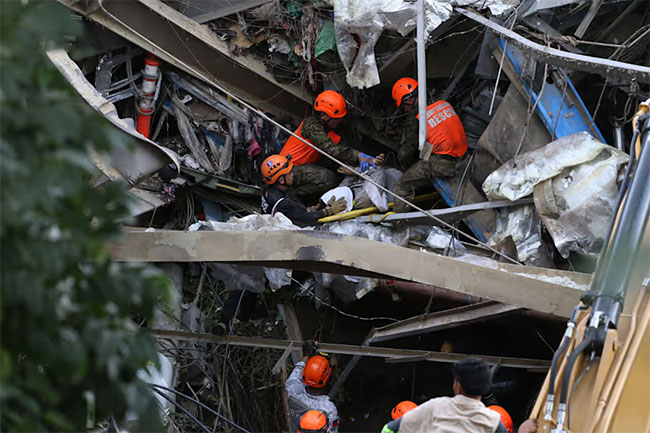 Death toll climbs after trash site collapse buries dozens in Philippines