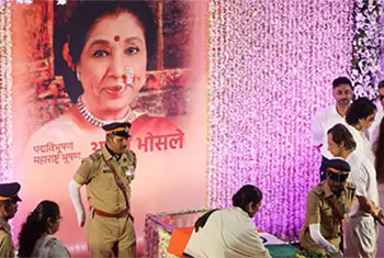 Mourners sing Asha Bhosle hit as iconic Indian singer cremated