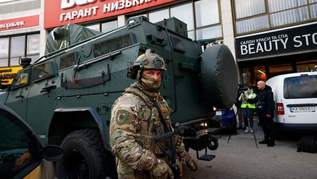 At least six killed in Kyiv as gunman opens fire and takes hostages