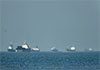 US and UAE report Iran attacks as military pushes to reopen Strait of Hormuz