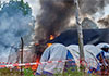 Angry crowd sets Ebola hospital tents on fire in DR Congo