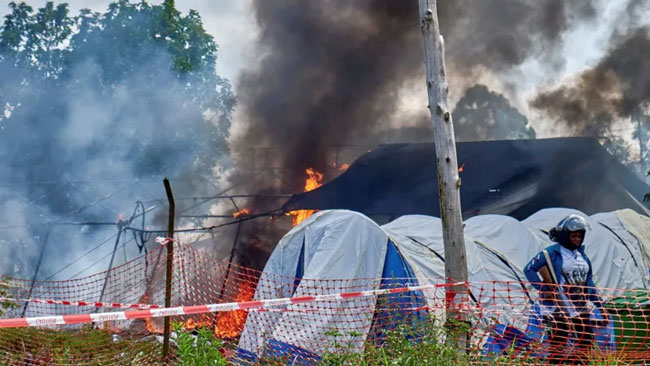Angry crowd sets Ebola hospital tents on fire in DR Congo